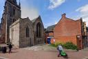 The disused toilet to the right, alongside St Peter's Church, Hereford