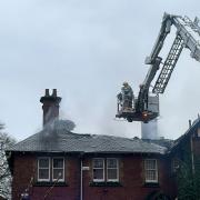 Firefighters tackling the blaze at the derelict building