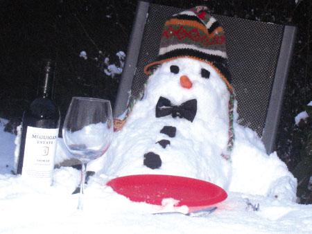 Alice and James Carter's snowman enjoying a glass of wine in the garden!