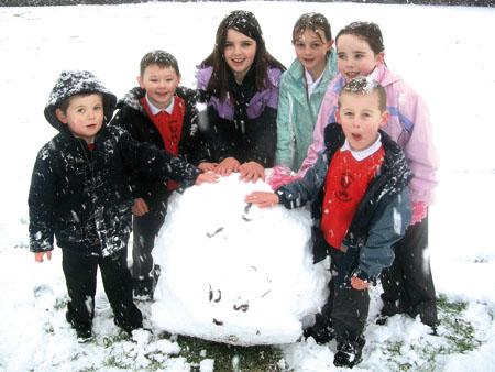 Children enjoy the snow at Withington Primary School.
