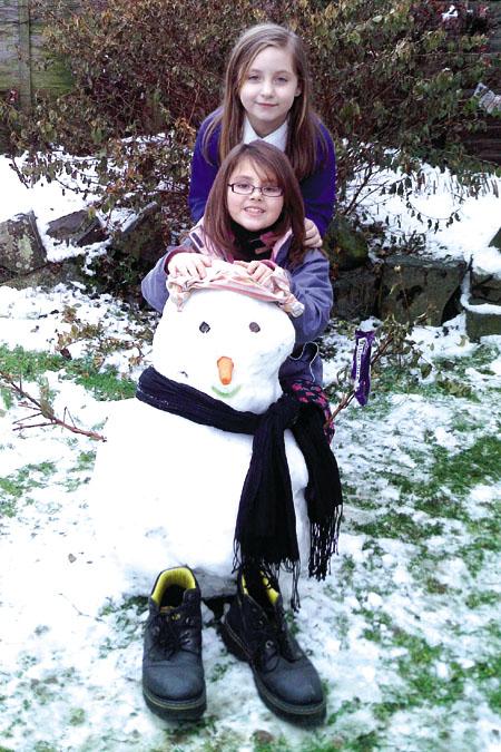 Jayde & Rachel with their snowman.