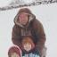 Having some sledging fun in the snow in Castle Green, Maddie, Megan and Mark Williams.