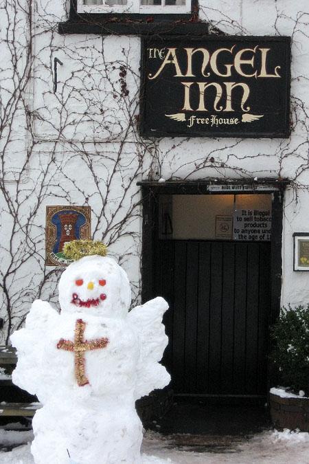 A snow angel outside The Angel Inn, Grosmont.