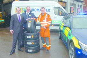 Dr Malcolm Russell (right), of MARS, picking up new  tyres for his emergency vehicle with Roger Davies, area operations manager, and Dean Gawler, operations manager at ATS Euromaster.