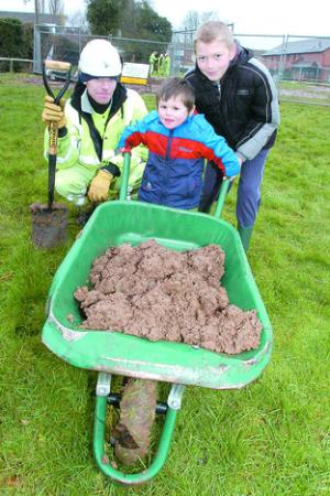 Helping out at Leominster’s new play area are, from left, Leyton Young, from contractors Amey, with Leo Stuchbury and Jamie Lock.