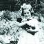 Rosemary Brown at four years old outside her home, Yew Tree Cottage, in How Caple.