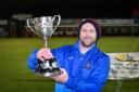 Hereford Lads Club manager Danny Moon lifts the Herefordshire FA County Challenge Cup. Picture: Will Cheshire.