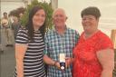 Pat Taylor with his daughter Emma (left) and wife Hazel celebrating his medal for 40 years long service