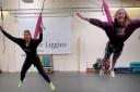 FLYING: Gym owner Julie Liggins and instructor Julia Potter enjoying Bungee Fitness