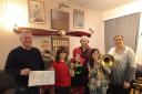 Knighton Town Silver Band (Training Band) members, pictured with show chairman Paul Davies.