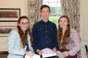 Nine A* and A grades between them - Lucton's Alice (left) and Rosie Oatham with George Quinn.