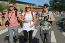 Simon Green, Hannah Lippett and Rick Solly setting off on their walk to Wales with a farewell from the entire student body.