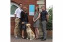 Stuart Matthew, Michelle Ivins, Sara Gillespie, and Sam Wright from Gough Bailey Wright, with office dog Nellie.