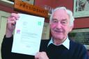 Ian Beer, pictured with a letter from Lord Coe, is fighting to save sport facilities in Ledbury.