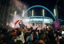 England fans celebrate outside Wembley Stadium after England qualified for the Euro 2020 final where they will face Italy on Sunday 11th July, following the UEFA Euro 2020 semi final match between England and Denmark. Picture date: Wednesday July 7,