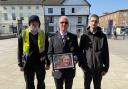 Stephen Cole with his sons Raymond Cole (left) and Christopher Cole (right) at Hereford's Covid vigil. Picture: Hattie Young