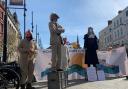 Environmental campaigners dressed as rats, chickens and judges in High Town