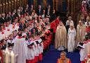 Bishop Richard Jackson accompanies the Queen Consort down the aisle at Westminster Abbey