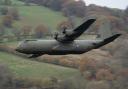 Iconic Hercules planes make farewell flypast as they retire from RAF