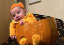 Six-week-old Owen Watkins from Herefordshire dressed as a Halloween pumpkin