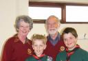 Ledbury Rotary Club president David Tombs and vice president Una Morganth with two of the Scouts, Tom Edwards and Joshua Beck, after donating £1,000 to help refurbish the Scout headquarters.
