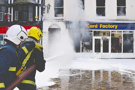 Firefighters tackle the fire in Card Factory.