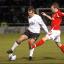 Kenny Lunt is challenged by Laurence Wilson. Kenny Lunt is challenged by Laurence Wilson.