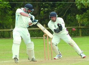 Brockhampton’s Henry Langford eases the ball away during the rain-affected draw with Bromsgrove. 112213-2 Picture by DAVID GRIFFITHS.