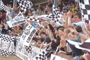 Supporters celebrate the Bulls' promotion at the end of the game.
