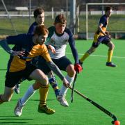 Hereford Hockey Club Men's 2 v Leominster A - Oli Smith competing against Hereford's Indy Jerram.