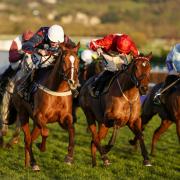 Song For Someone (left) on his way to winning International Hurdle at Cheltenham races on Saturday. Trainer Tom Symonds also had a win at Hereford Racecourse on the same day. Picture: Alan Crowhurst/Getty Images