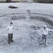 Kier and Philip Rogers stand in the crop circle that appeared in a field just outside of Hereford in August 1990