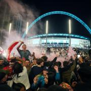 England fans celebrate outside Wembley Stadium after England qualified for the Euro 2020 final where they will face Italy on Sunday 11th July, following the UEFA Euro 2020 semi final match between England and Denmark. Picture date: Wednesday July 7,
