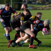 Chris Poynton on his way to grounding the ball in the match against St Leonards. Picture: Andy Compton