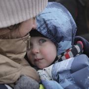 A woman holding a young child arrives at the border crossing in Medyka, Poland. More than 1 million people have fled Ukraine after Russia's invasion. The Hereford Times and its sister news titles across the UK have now launched an appeal to help