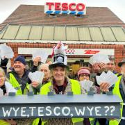 Marches Climate Action demonstrators with the cards which they asked shoppers to submit to Tesco\'s central Hereford store.