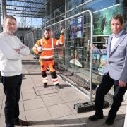 By part of the Courtyard's exterior which requires work, from left: chief executive Ian Archer, Michal Kosciukiewicz of Vertex Access, and theatre board chairman Bruce Freeman.