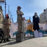 Environmental campaigners dressed as rats, chickens and judges in High Town