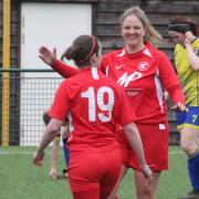 Hereford Pegasus Ladies skipper Emily Morgan celebrates scoring with team-mate Abbie Wilson.