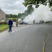 Firefighters tackle a vehicle fire in Dorstone