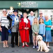 From left: Sue Cooper, town crier Peder Nielsen, Mayor of Bromyard, Cllr Dee Dunne-Thomas, Hugh Farey, Graham Collins, Jacqui Galloway (with her two grandchildren, Tabather and Oliver) and Archie the dog