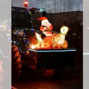 Santa on a lit up tractor