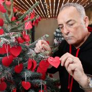Pub landlord Chris Owen-Howells with the Christmas tree