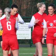 Goal scorer Roxana Dinescu is congratulated by her team-mates in their 3-1 win against Droitwich Spa