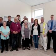 Photo includes the Speller Metcalfe team, local residents and representatives from suppliers who donated materials; Jewsons, Travis Perkins and Woods Insulation.