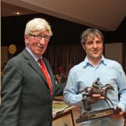 Dick Pike presents Rob Hodges with a memento on his retirement after 18 years of race riding.