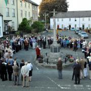 People paying their respects at a vigil to mark the centenary of the start of the First World War in Kington.