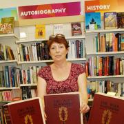 OXFAM Manager Janet Gilbert, Manager, with The War Illustrated magazine.ENDS (9781533)