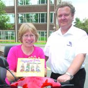 Road safety officer Ann Mann and Dave Kelly, of TPG Disabled Aids, with the new code. 083616-1.