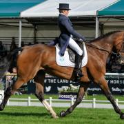 Louise Harwood competing at the Burghley Horse Trials